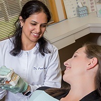 Dr. Taneja smiling at patient