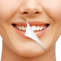 Woman with attractive smile from cosmetic dentist.