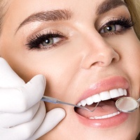 Woman with a beautiful smile from cosmetic dentist. 