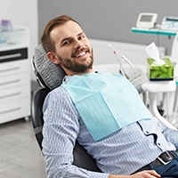 Man smiling in dentist’s chair