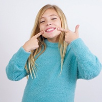 girl happy with cost of cosmetic dentistry in Bellevue
