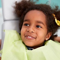 Little girl smiling in dental chair