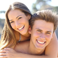 Couple smiling on a beach