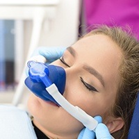 Woman with nitrous oxide mask